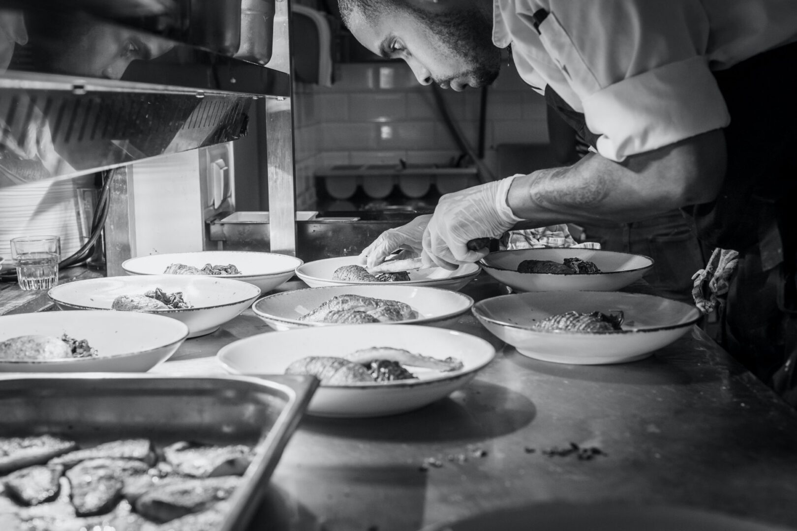 A Black and White Image of a Chef Working