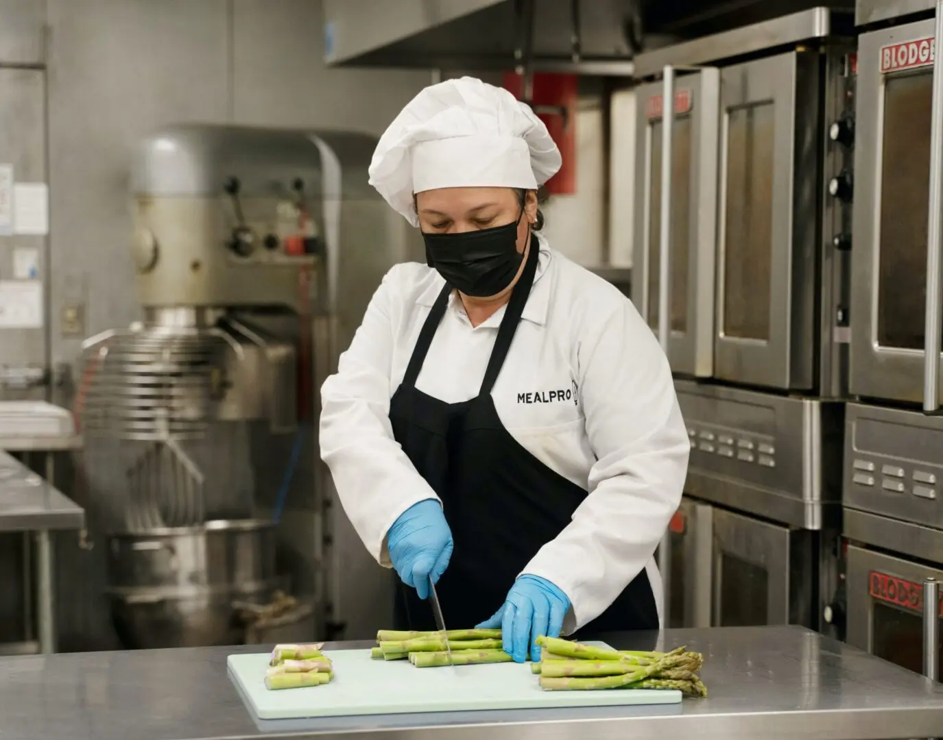 A Chef Working on Chopping Vegetables