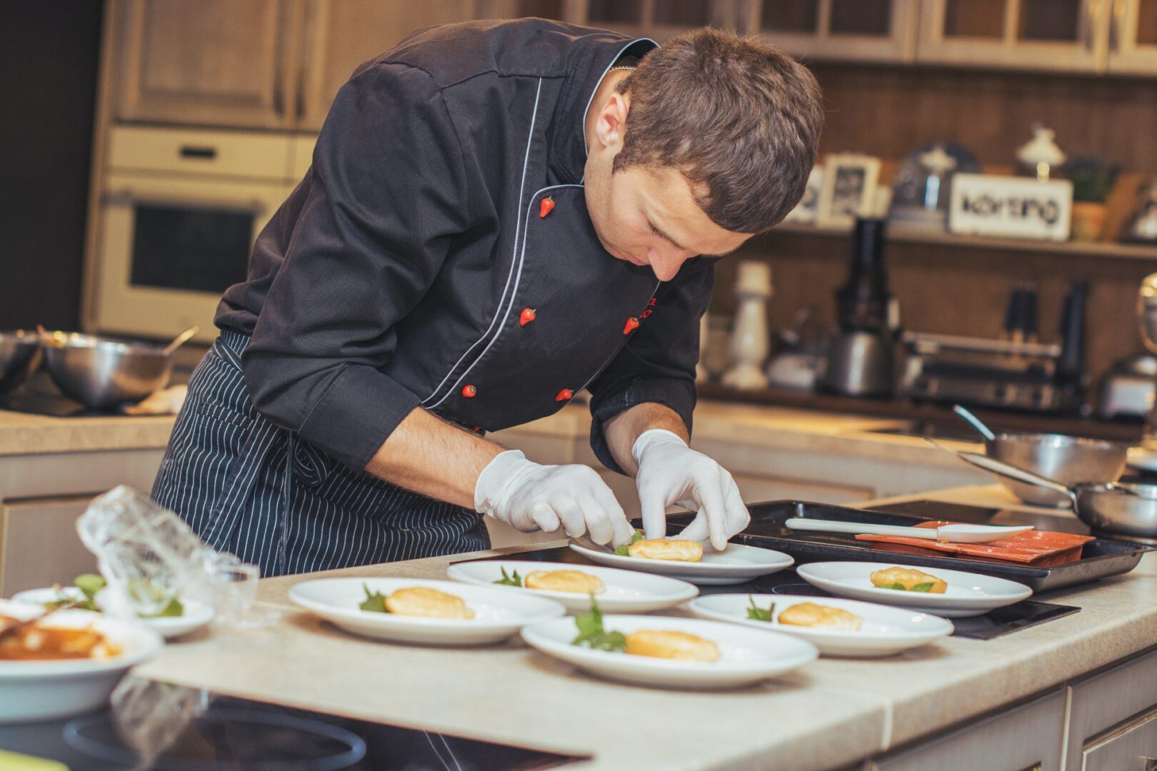 A Chef in Dark Color Clothes With an Apron